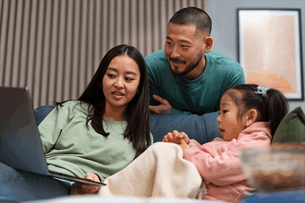 Family Viewing Laptop at Home