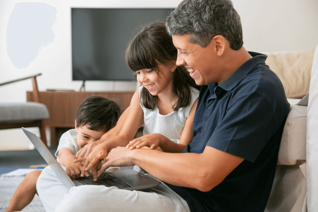 Happy Family On Laptop